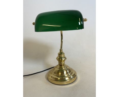 A modern library or bankers style lamp with green glass tilting shade and gilt metal base. H:37cm