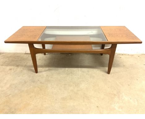 A G Plan style teak mid century teak coffee table with glass centre insert, magazine shelf underneath. W:138cm x D:51cm x H:4