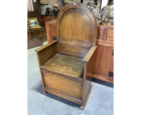 An oak 20th century hall seat or commode chair.W:61cm x D:42cm x H:114cm