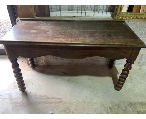 A late 19th century bobbin turned low table. W:121cm x D:51cm x H:69cm