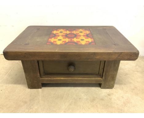 A modern coffee table with drawer, wooden painted tile effect to top. W:100cm x D:65cm x H:43cm