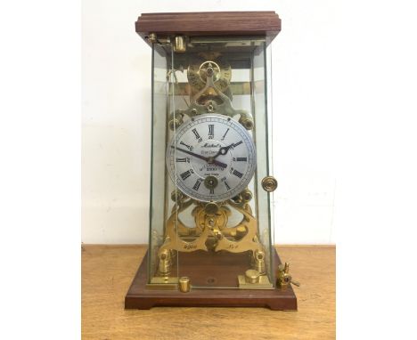 A large millennium Skelton clock with brass fussee movement. Hand made in chipping Sodbury in glazed, brass and wood case.   