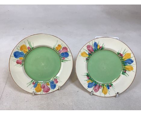 A pair of Clarice Cliff Spring Crocus plates. Slight wear to base W:16cm 