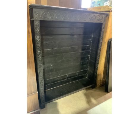 A carved and ebonised open bookshelf with potentially four adjustable shelves however no shelf rests.W:122cm x D:32cm x H:152