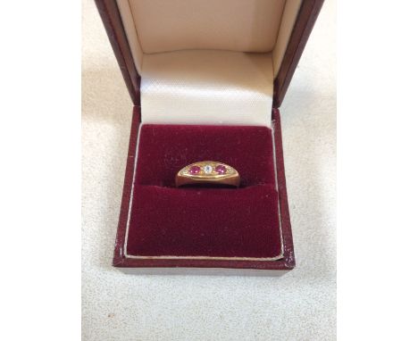 An 18 carat gold ring set with ruby and white stone. Size K/L. Total weight 3gm. Box not included 