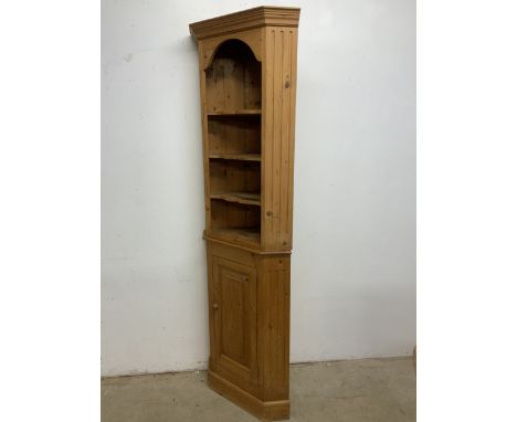 A solid pine two piece corner cupboard with three shaped shelves above cupboard with internal shelf. W:45cm x D:45cm x H:208c