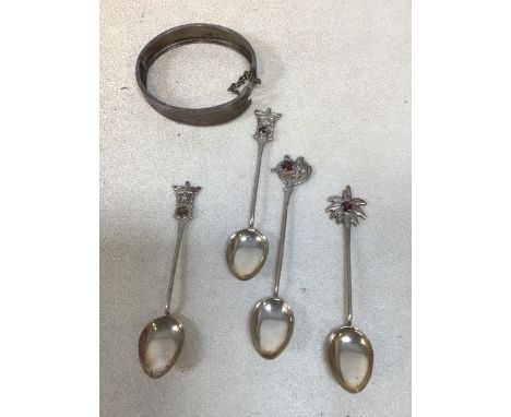 A white mental engraved bangle sixth four continental silver spoons marked SS 