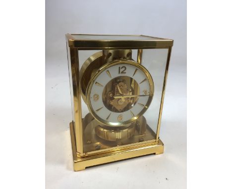 A Jaeger Le Coutre Atmos Classic V clock, with booklet. W:18cm x D:13.5cm x H:22cm