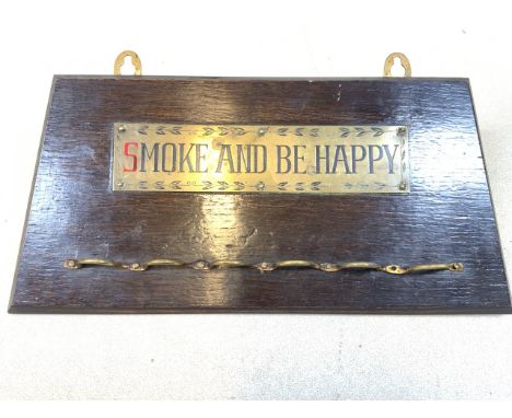 An oak pipe rack with brass plaque - Smoke and be happy.  W:29cm x H:14cm