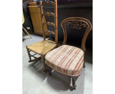 A rush seated ladder back childs rocking chair also with another childs chair. 