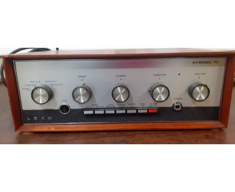A vintage Leak stereo 70 amplifier in teak housing, serial no:2/49064, with manual, no plug. Location:GIf there is no conditi