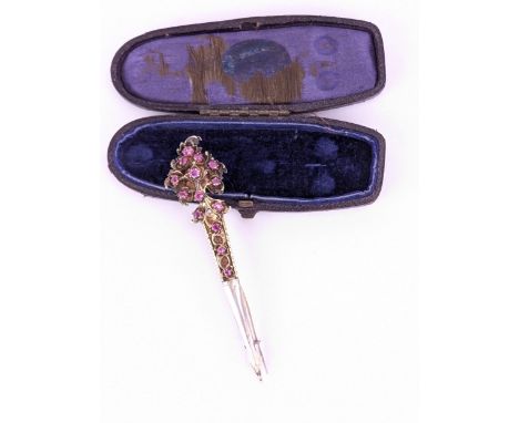 An Indian/Sri Lanka silver gilt turban/hair pin set with rubies and a pearl, with an arrow shaped end, in a leather clad and 
