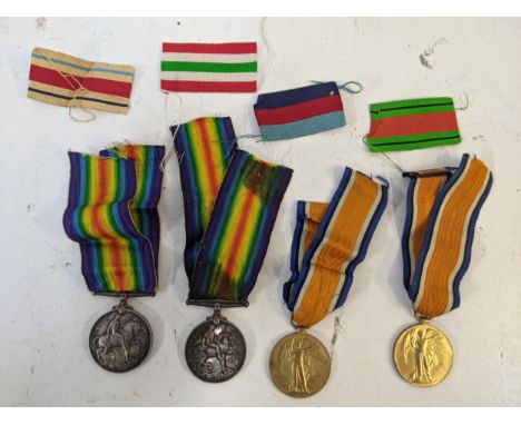 Four medals WWI - a Defence medal and a Victory medals inscribed "217759 GNR K Fraser R.A", one defence medal inscribed "6818