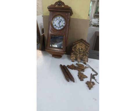 A mid 20th century cuckoo clock together with one other wall hanging clock A/FLocation:If there is no condition report shown,