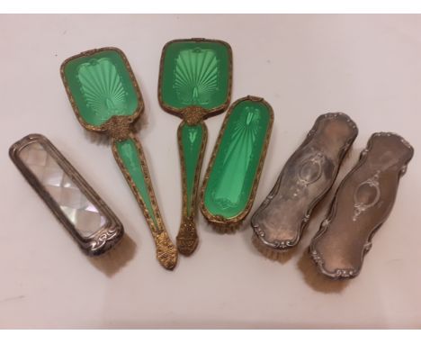A collection of vintage dressing table brushes to include 3 green Guilloche effect items, a silver and mother off pearl cloth