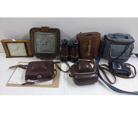 A mixed lot to include cameras, a pair of Health & Co binoculars, oak barometer and a Swiza desk clockLocation: 11.3If there 