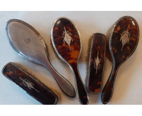 Four silver and tortoiseshell brushes, an engine turned silver hairbrush, mixed vintage thimbles and other items. Location: