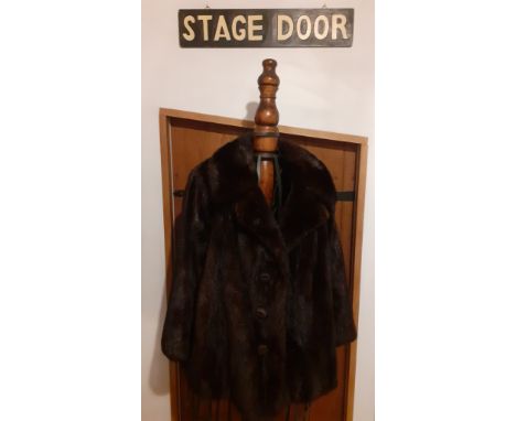 A vintage dark brown/black glossy mink jacket with brown satin lining and 3 brown fabric covered show buttons with a hook and