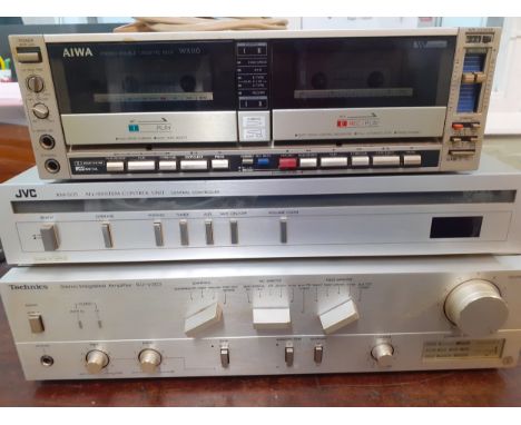 An Aiwa stereo double cassette deck AD-WX 110K Dolby B-C NR (no plug) together with a Technics stereo integrated amplifier SU