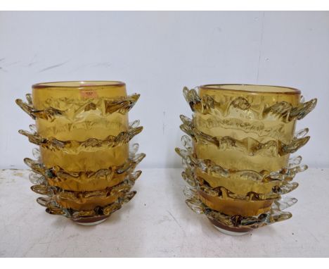A pair of vintage amber coloured vases with horizontal bands of spiked leaf petals in clear glass 29cms high LocationIf there