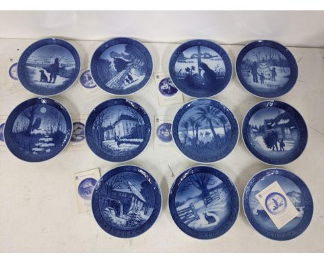 Eleven Royal Copenhagen Christmas plates mainly from the 1970s depicting various winter scenesLocation 6.2If there is no cond
