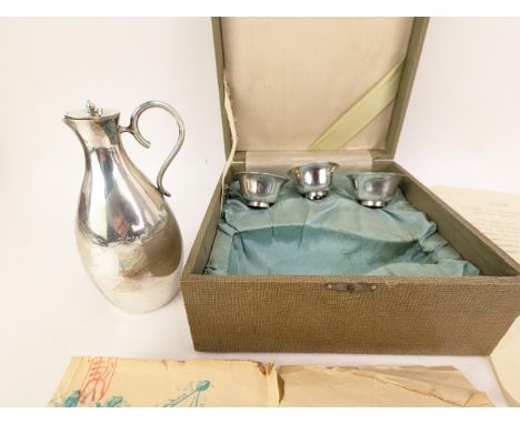 A mid 20th century South Korean silver sake set, the lidded jug engraved with text 'Governor of South Jeolla Province Choo Ju