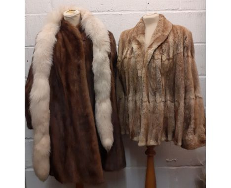 A late 1970's/early '80's Saga brown mink hip length coat having bellow sleeves by JW Scott Furriers, Huddersfield with brown