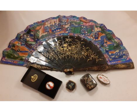 A Chinese fan A/F having 15 black lacquered guards and sticks with gold painted decoration of a pond, ducks and floral swags 