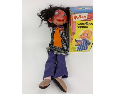 A Pelham ventriloquial puppet, wearing a check jacket and blue and blue trousers, boxedLocation:If there is no condition repo