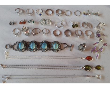 Modern costume jewellery to include a True Diamonds silver and coloured crystal ring and other dress rings, a silver and ambe