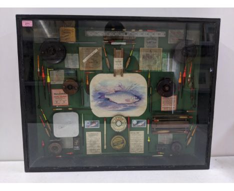 A glazed angling display case/collage displaying a range of floats, reels and tackle 64cm h x 80cm w Location: LWBIf there is