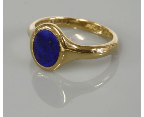 An 18ct gold lapis lazuli set signet ring, with hand engraved inscription to the inside of the shank