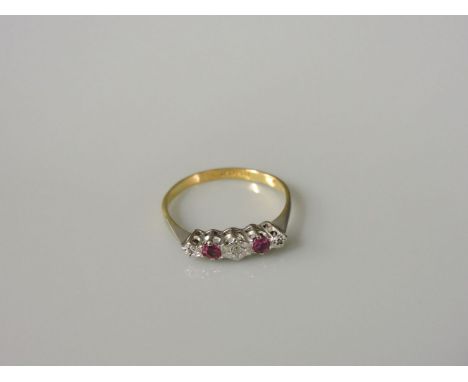 A five stone graduated diamond and ruby ring, marked 18ct plat