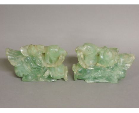 A pair of 20th century jade mythical birds, 15cm long, and six various Chinese scent bottles and stoppers, two porcelain and 