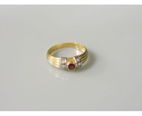 An 18ct gold single stone ruby ring, with diamond set arched shoulders and reeded tapering shank