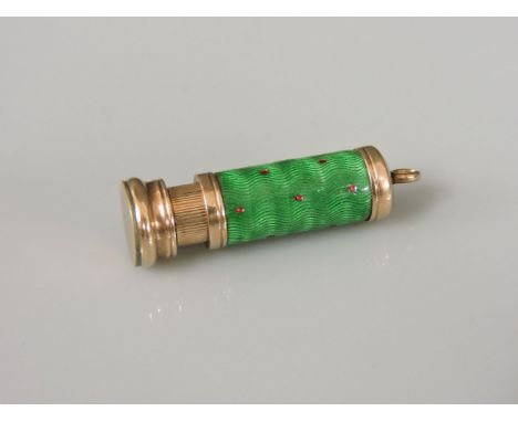 A gold miniature propelling pencil, with green guilloché enamel and red dot body, marked 9ct