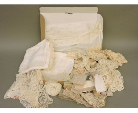 A box of assorted lace and linens, including bobbin lace and trim