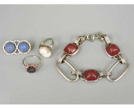 A Continental silver chalcedony and enamel brooch, marked 935, a shell cameo ring, a sapphire ring, and a silver bracelet set