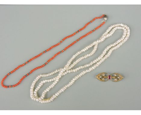 A 9ct gold ruby and cultured pearl brooch, a single row uniform coral bead necklace, and a single row cultured freshwater pea
