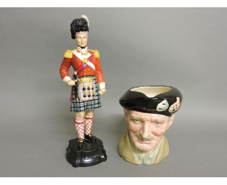A Royal Worcester figure, 'Officer of the Seaforth Highlanders' 2657, and a Royal Doulton character jug 'Monty'