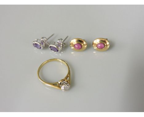 A pair of 18ct gold single stone amethyst stud earrings, a pair of 9ct gold cabochon ruby earrings, and an 18ct gold single s