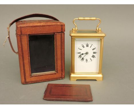 A French brass carriage clock, with leather travel case