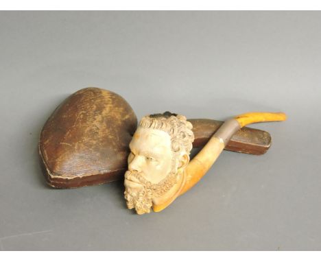A large 19th century Austrian Meerschaum pipe, in the form of a negro gentleman's head, with gold coloured metal collar and a