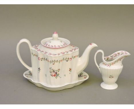 An 18th century Newhall 'silver shape' teapot, and a matching helmet shape cream jug, pattern no 186