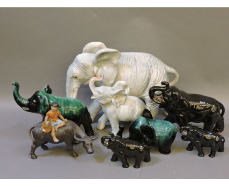 A collection of ceramic elephants, including three Sylvac examples