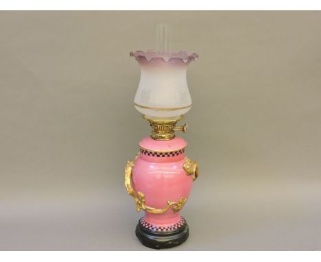 An unusual vase oil lamp, by C T Maling & Sons, circa 1915-20, the ceramic body modelled with gilded dragons in the Oriental 