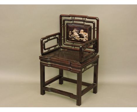 A Chinese hardwood and mother of pearl inlaid armchair, and a Chinese carved camphor wood trunk, 106cm