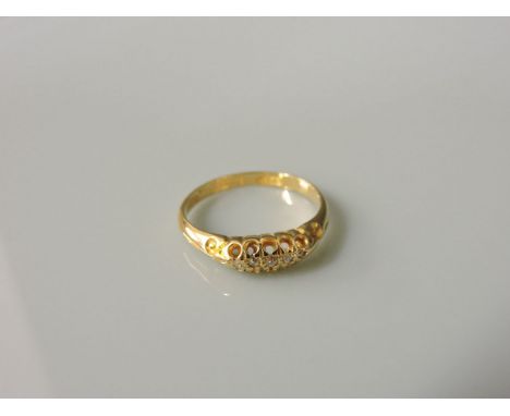 An 18ct gold Edwardian five stone diamond boat shaped ring