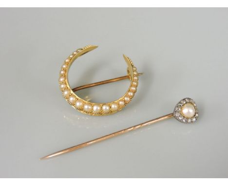 A split pearl and diamond heart shaped gold stick pin, and a split pearl gold crescent brooch marked 15ct