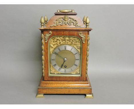 An oak bracket clock, the silvered chapter ring within brass spandrels supporting a single fusee movement, 34cm high, the dia